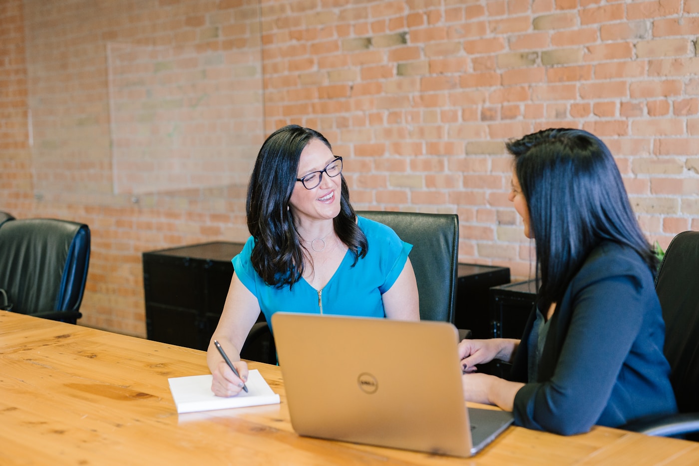 A Passage admissions advisor reviewing a student's profile together at a table