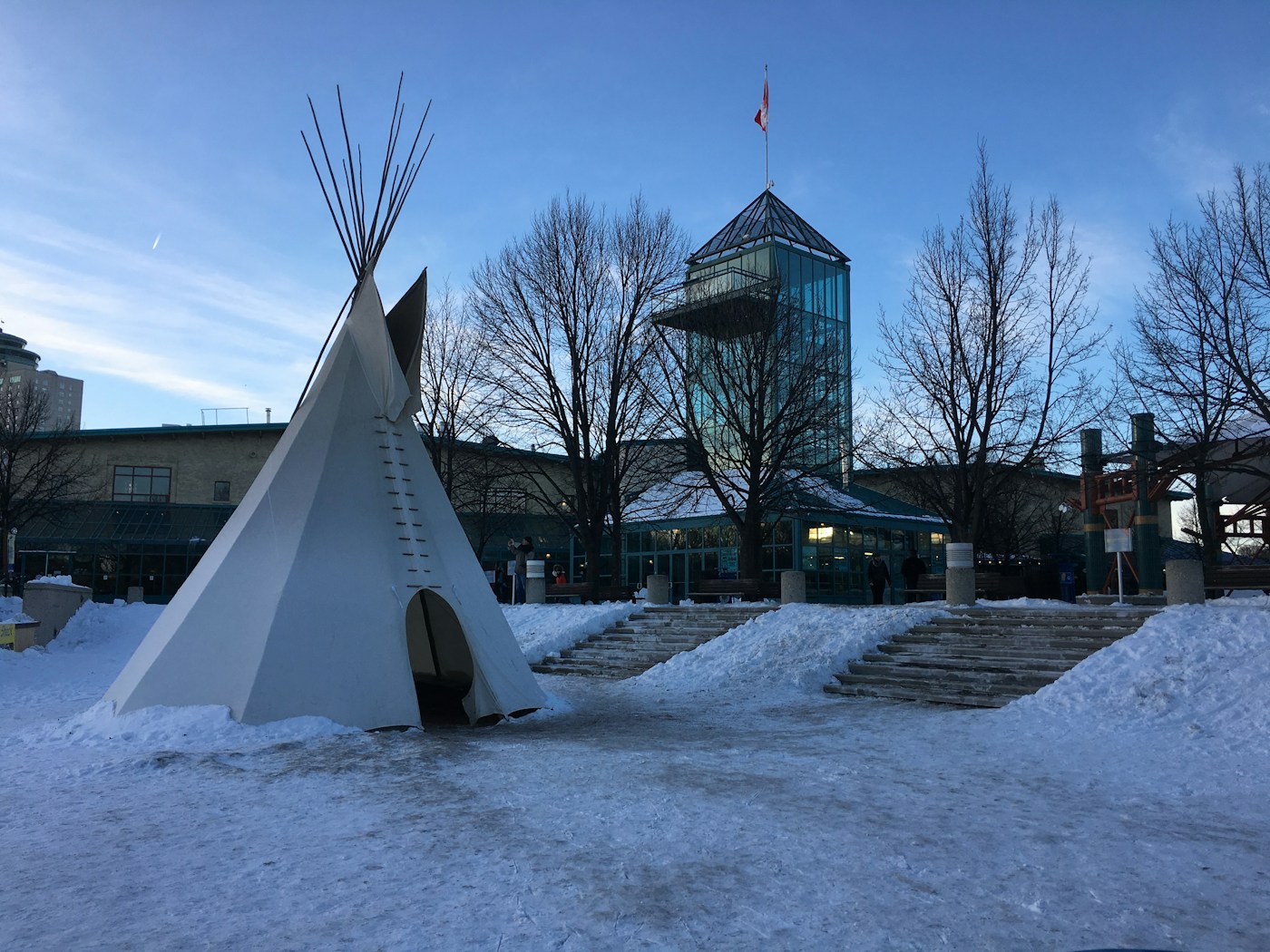 A teepee at The Forks in Winnipeg under a bright, clear winter sky